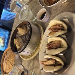 Xiao Long Bao Pork Soup Dumplings; Braised/Spicy Beef Brisket Noodles, Duck Buns Xiao Long Bao Pork Soup Dumplings; Braised/Spicy Beef Brisket Noodles, Duck Buns