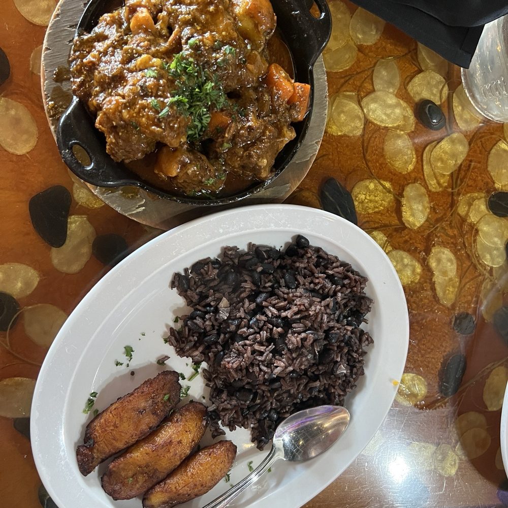 Bella Cuba - Oxtail stew with black bean rice and friend sweet plantains - Cuban Near Me - Miami Beach, Florida Bella Cuba - Oxtail stew with black bean rice and friend sweet plantains - Cuban Near Me - Miami Beach, Florida