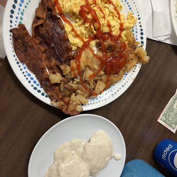 Sunnyside Grill - a plate of eggs, bacon, hash browns, and ketchup - New American Near Me - Panama City Beach, Florida
