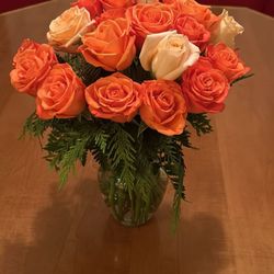 Mae Flower & Gift Shop - Orange róses flower arrangement.