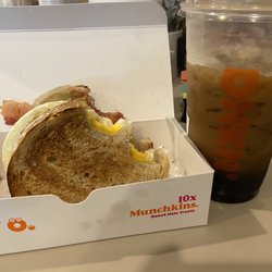 Dunkin' - Sourdough breakfast sandwich & brown sugar cold foam not pictured strawberry frosting donut with sprinkles