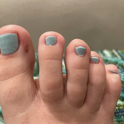 The Nail Place - Worst pedicure I've ever received. Didn't clean the polish off my skin and didn't even paint the entire nail.
