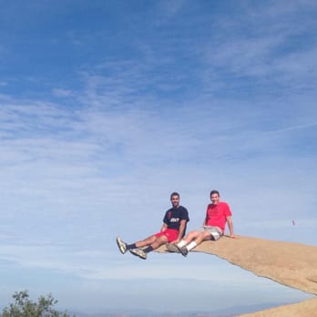 Mount Woodson Trail - Sitting on potato chip rock - Hiking Near Me - Poway, California Mount Woodson Trail - Sitting on potato chip rock - Hiking Near Me - Poway, California