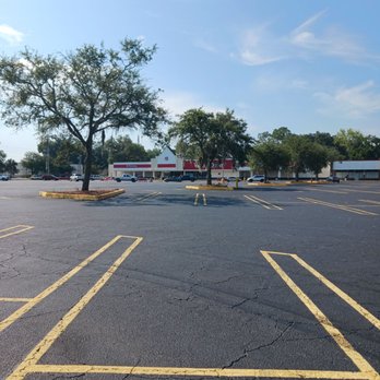 Winn-Dixie - a parking lot with a tree in the middle - Grocery Near Me - Perry, Florida Winn-Dixie - a parking lot with a tree in the middle - Grocery Near Me - Perry, Florida