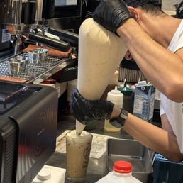 PK is pipping cream on my ice latte with coffee jelly PK is pipping cream on my ice latte with coffee jelly