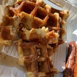 a plate of waffles and carrots