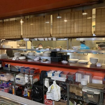 East Street Cafe - a kitchen with a lot of dishes on the counter - Chinese Near Me - Washington, DC, District of Columbia