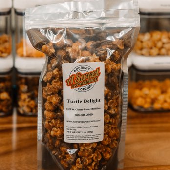 A Sweet Experience - Turtle Delight has both milk chocolate and candied pecans in the mix. It's our most decadent flavor!! - Popcorn Shops Near Me - Meridian, Idaho