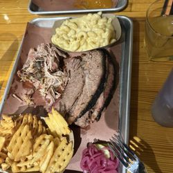Backyard BBQ - 1/2 lb brisket 1/2 lb pulled pork waffle fries & hawk cheese