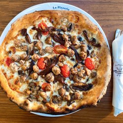 COVID OUTDOOR DINING: Pizza Alla Boscaiola w/ mozzarella+gorgonzola cheese, wild+porcini mushrooms, tomatoes, truffle oil | $22 + $4 sausage