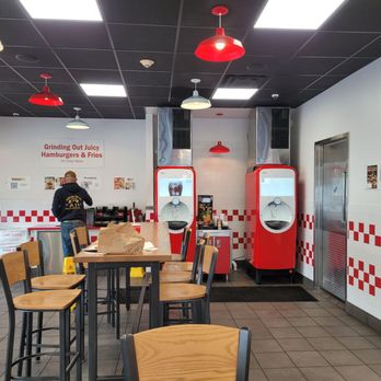 Five Guys - a restaurant with red and white checkered walls - Burgers Near Me - Hauppauge, New York