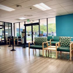 Community Health Alliance - Wells Ave Health Center - Part of the waiting area and a view of the main entrance plus the entrance to the pharmacy