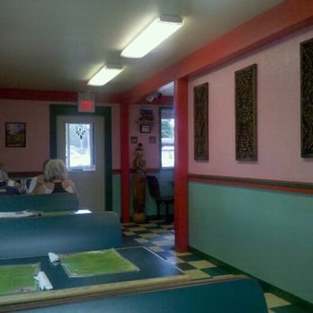 Hot Spot Thai - a woman sitting at a table - Thai Near Me - Polson, Montana Hot Spot Thai - a woman sitting at a table - Thai Near Me - Polson, Montana