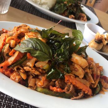 Krua Thai - Drunken noodles spicy level 8. Definitely had a strong kick! Beware! ! Pictured in the back Pad Ga Prow Kai Dow. - Thai Near Me - Chula Vista, California Krua Thai - Drunken noodles spicy level 8. Definitely had a strong kick! Beware! ! Pictured in the back Pad Ga Prow Kai Dow. - Thai Near Me - Chula Vista, California