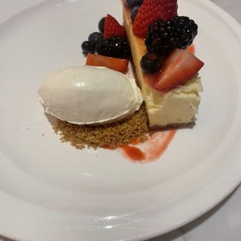 Gordon Ramsay Hell's Kitchen - Another complimentary dessert. Cheese cake topped with berries and strawberries. Whipped cream on the side. My son said it was very good. - Desserts Near Me - Washington, DC, District of Columbia