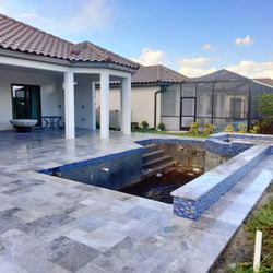 Penca Paver Resorts - New Pool Deck construction! The recently built pool got its amazing Champaign. A travertine made in turkey tile style deck with drainage