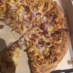 Pizza with added bacon that was not ordered Pizza with added bacon that was not ordered