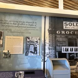 Signage stating "I am an American" right after the attack on Pearl Harbor