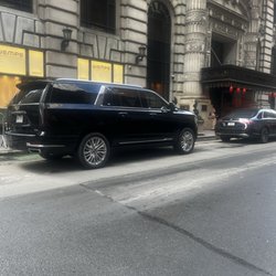 Parked and ready in Manhattan. Our Cadillac Escalade ESV providing luxury transportation throughout New York City.