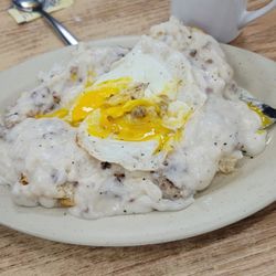 JJ's Truckstop and Restaurant - 11/30/23 Two biscuits and gravy one egg over easy on top  Cawfee
