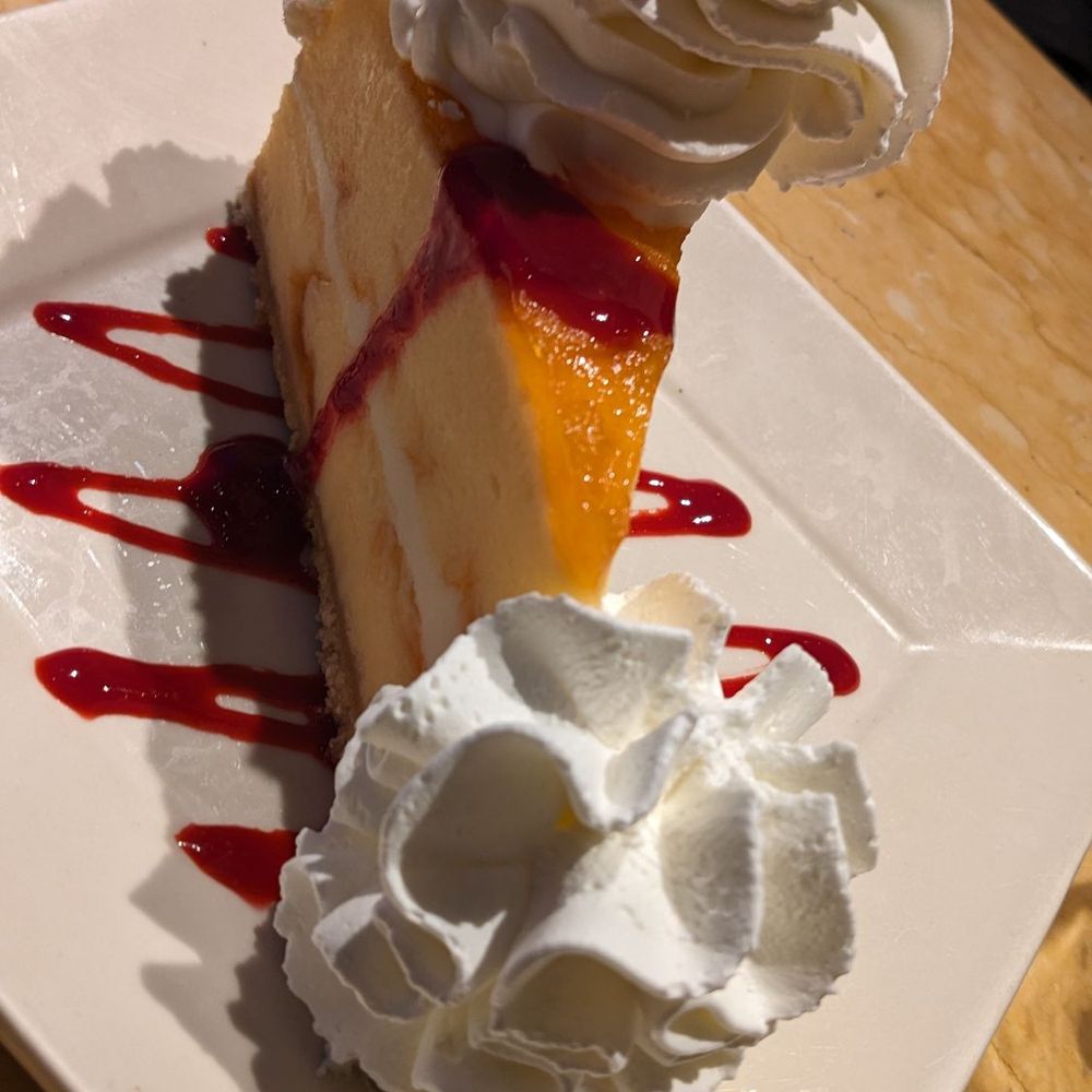 The Cheesecake Factory - Peach perfect cheesecake with a drizzle of raspberry - Desserts Near Me - Westbury, New York The Cheesecake Factory - Peach perfect cheesecake with a drizzle of raspberry - Desserts Near Me - Westbury, New York
