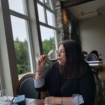 Vignoble du Ruisseau - a woman enjoying a glass of wine - Sugar Shacks Near Me - Dunham, Quebec