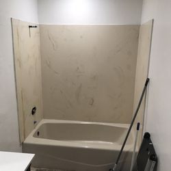 Legacy Bathtub Refinishing - We stripped our shower of the door and all fixtures ahead of time as we're renovating the entire bathroom.