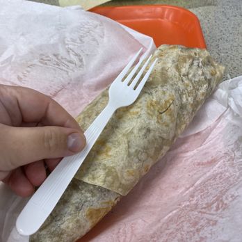 Mexi Drive - Choncho Burrito with fork for scale - Mexican Near Me - Kent, Washington Mexi Drive - Choncho Burrito with fork for scale - Mexican Near Me - Kent, Washington