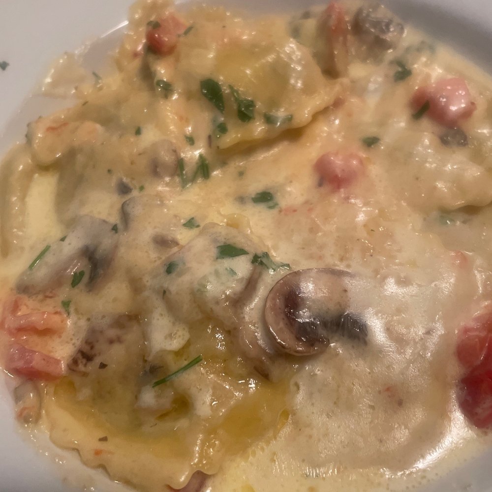Portabella mushroom ravioli in Alfredo sauce with tomatoes