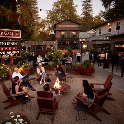 Calistoga Inn - Restaurant - Guests enjoying the fire pit at the entrance to our 150 seat patio on the Napa River