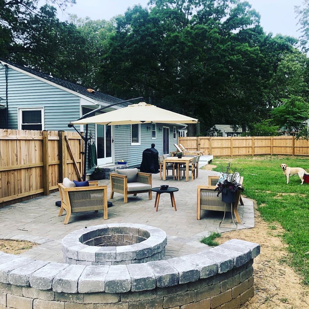 a patio with a fire pit