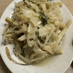 Stew bamboo shoots with sour mustard green.