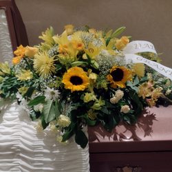 Schafer's Flowers - Yellow casket spray.