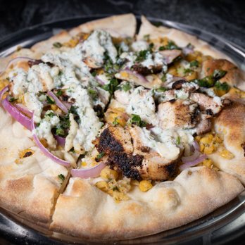 Feast - Chicken Shawarma Flatbread
red onions, crushed chickpeas, tahini salad, cucumber yogurt, and cilantro - New American Near Me - Gibsonia, Pennsylvania Feast - Chicken Shawarma Flatbread
red onions, crushed chickpeas, tahini salad, cucumber yogurt, and cilantro - New American Near Me - Gibsonia, Pennsylvania