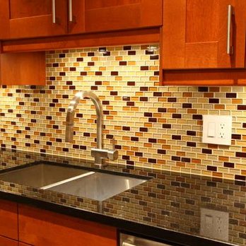 Gianni Durigon - a kitchen with a sink and a dishwasher - Flooring Near Me Gianni Durigon - a kitchen with a sink and a dishwasher - Flooring Near Me