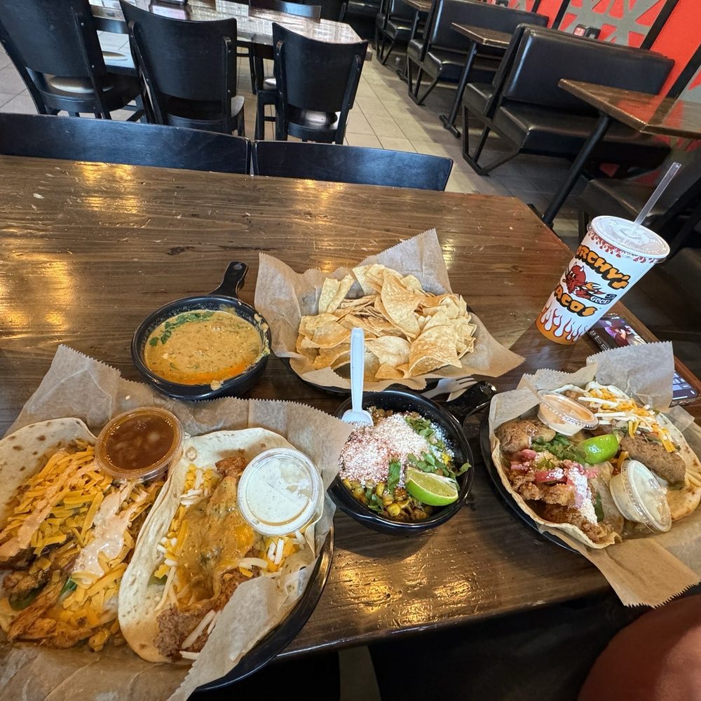 Torchy's Tacos - (Left to right) Trailer park trashy, Tipsy chick, queso and chips, street corn, Baja shrimp, trailer park. - Tex-Mex Near Me - Fishers, Indiana Torchy's Tacos - (Left to right) Trailer park trashy, Tipsy chick, queso and chips, street corn, Baja shrimp, trailer park. - Tex-Mex Near Me - Fishers, Indiana