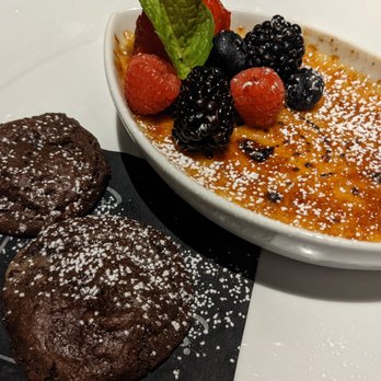 Eddie V's Prime Seafood - A large portion of crème brûlée topped with fresh, tart berries, and rich, indulgent chocolate cookies. So good! - Seafood Near Me - Troy, Michigan Eddie V's Prime Seafood - A large portion of crème brûlée topped with fresh, tart berries, and rich, indulgent chocolate cookies. So good! - Seafood Near Me - Troy, Michigan