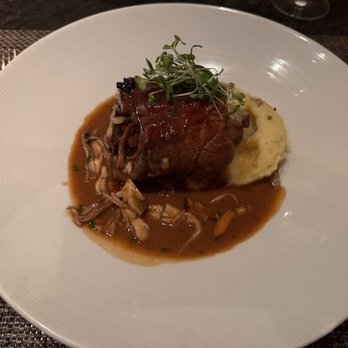 Geronimo - Maple-black pepper roasted pork shank: mile mushrooms, brandied demi-glace & baby greens with garlic mashed potatoes - French Near Me - Santa Fe, New Mexico