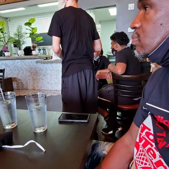 Avenue Brunch House - The bus boys sit and stand a dining table to wait for tables to clear. - Breakfast & Brunch Near Me - Dearborn, Michigan Avenue Brunch House - The bus boys sit and stand a dining table to wait for tables to clear. - Breakfast & Brunch Near Me - Dearborn, Michigan