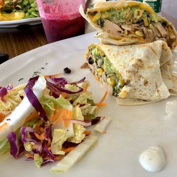 Revelations Cafe - Jackfruit Carnitas Burrito with slaw and dollops of crema. Peace Juice (beet, apple, cucumber). - Breakfast & Brunch Near Me - Lutz, Florida
