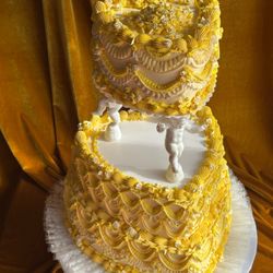 6+10+12" tiered heart cake with vintage cherub columns.