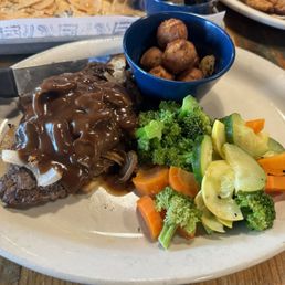 Chopped steak with vegetables and hush puppies