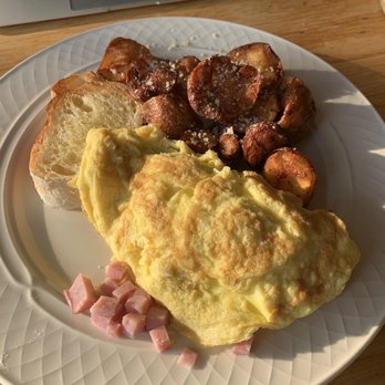 Turtle Bread - an omelet with ham and potatoes on a plate - Bakeries Near Me - Minneapolis, Minnesota