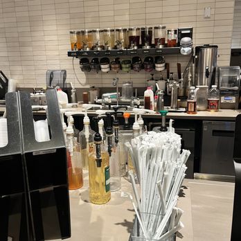 Starbucks - a counter with a variety of items on it - Coffee & Tea Near Me - Salisbury, North Carolina