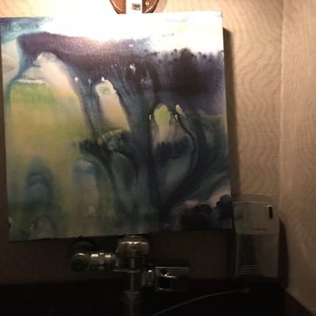 Chart House - Lovely art just sitting on the handle of the urinal. - Seafood Near Me - Savannah, Georgia