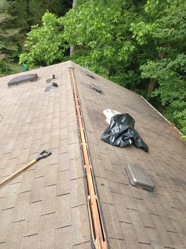 Slide of J AND G ROOFING