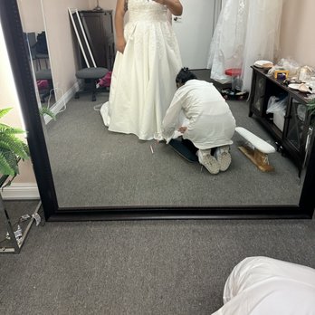 Professional Bridal Alterations - Lana "fixing" the hem of the dress even though it ended up super uneven. - Sewing & Alterations Near Me - Orange, California Professional Bridal Alterations - Lana "fixing" the hem of the dress even though it ended up super uneven. - Sewing & Alterations Near Me - Orange, California