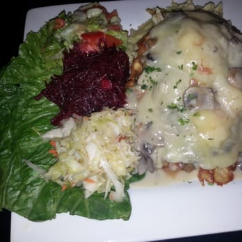 Old Vilnius Café - Pork Tenderloin with Swiss Cheese and Lithuanian Sides - Modern European Near Me - Darien, Illinois Old Vilnius Café - Pork Tenderloin with Swiss Cheese and Lithuanian Sides - Modern European Near Me - Darien, Illinois