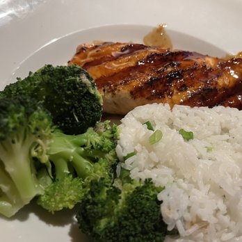 Glory Days Grill - Salmon rice broccoli - A meal featuring grilled salmon with a glaze, steamed broccoli, and white rice garnished with chopped green onions. - American Near Me - Frederick, Maryland