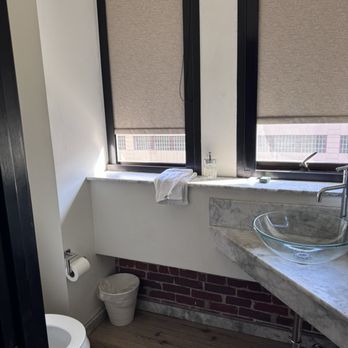 The Haas Building - Toilet and sink in 1/2 of the bathroom. - Apartments Near Me - Los Angeles, California